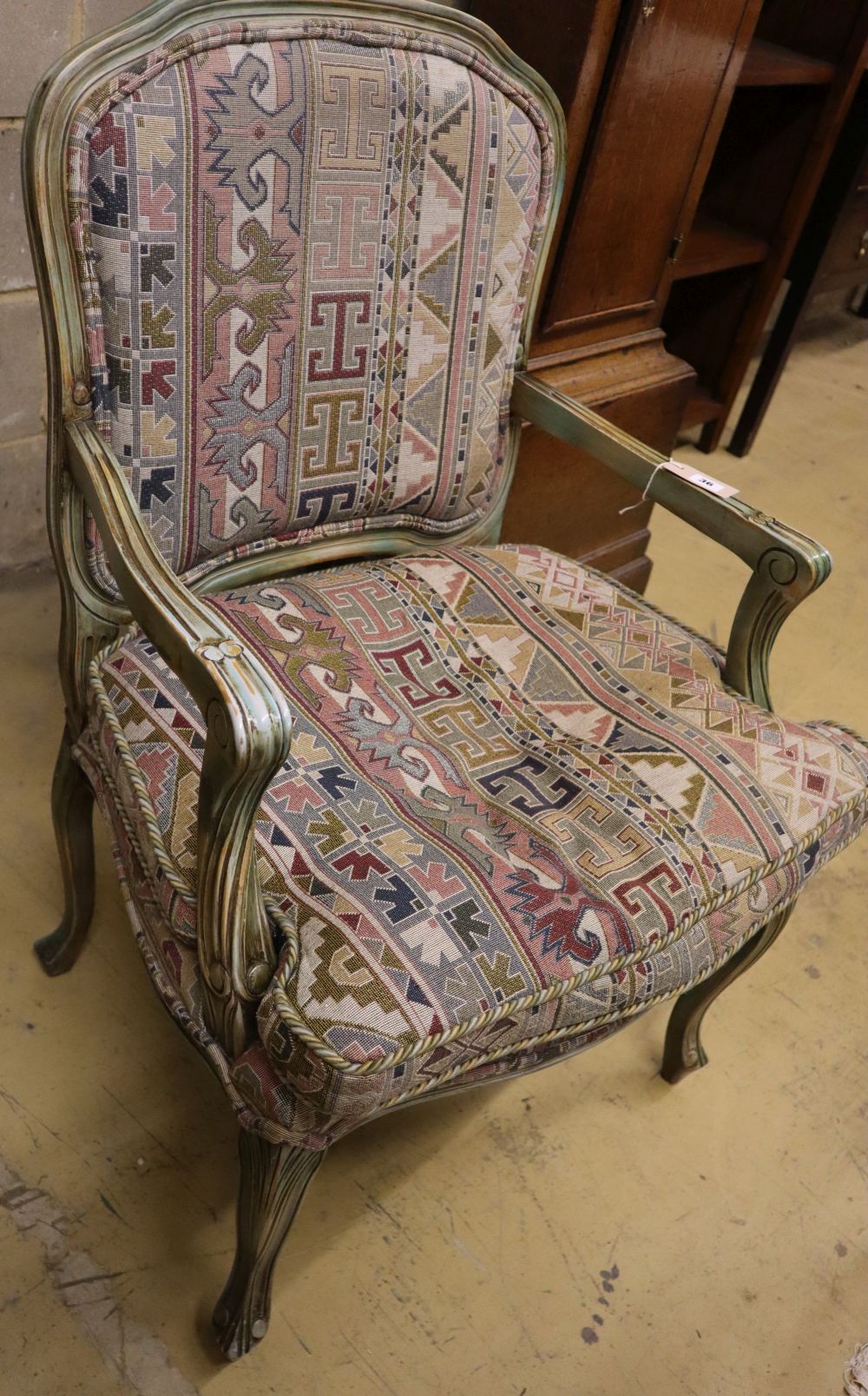 A French painted upholstered open armchair